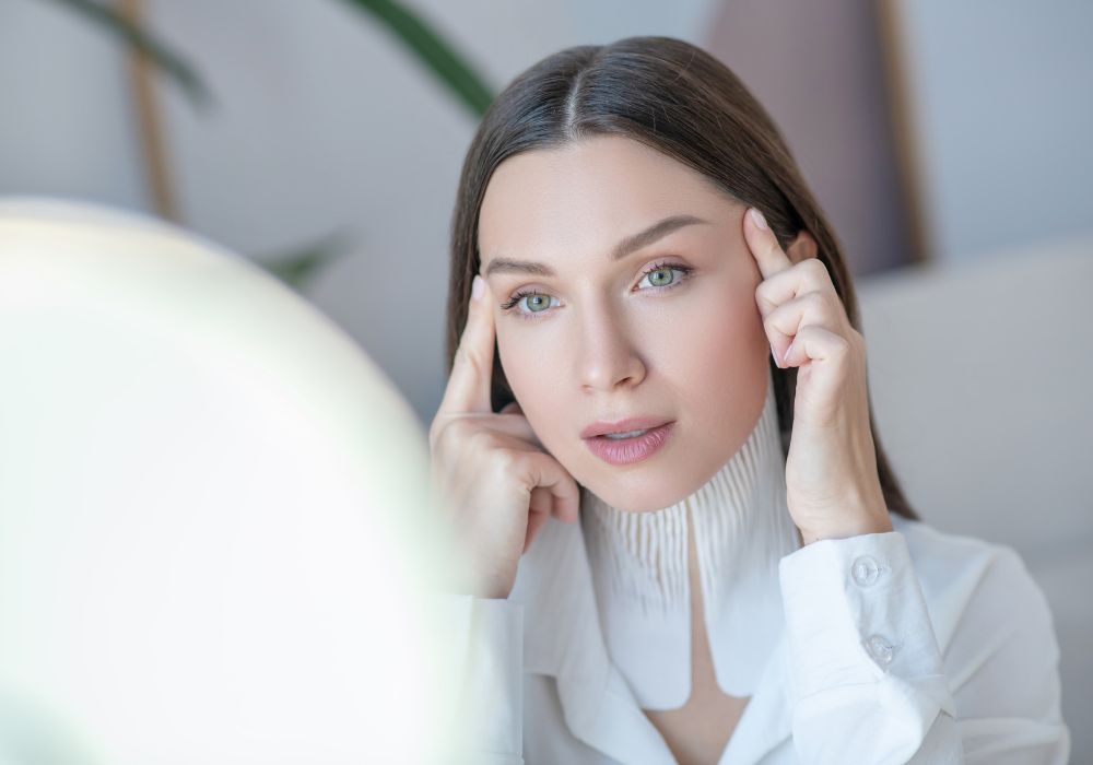 women checking her wrinkles with anti wrinkle peptide