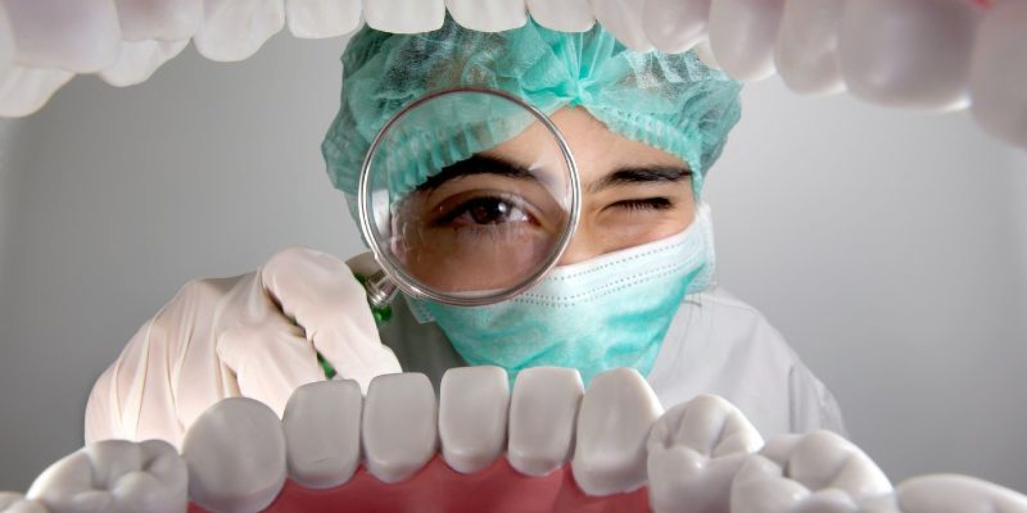 dentist observing patients mouth for repairing oral mucosa with peptides